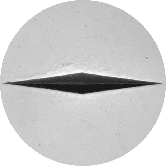 Knoop microhardness indentation viewed under the microscope