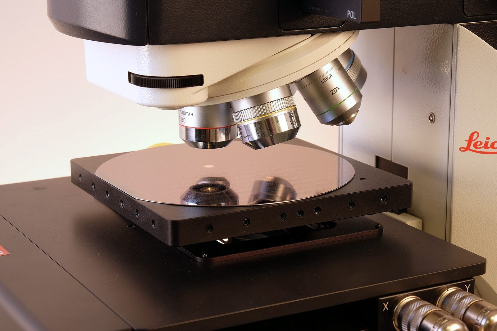 Close-up inspection of a wafer under the microscope